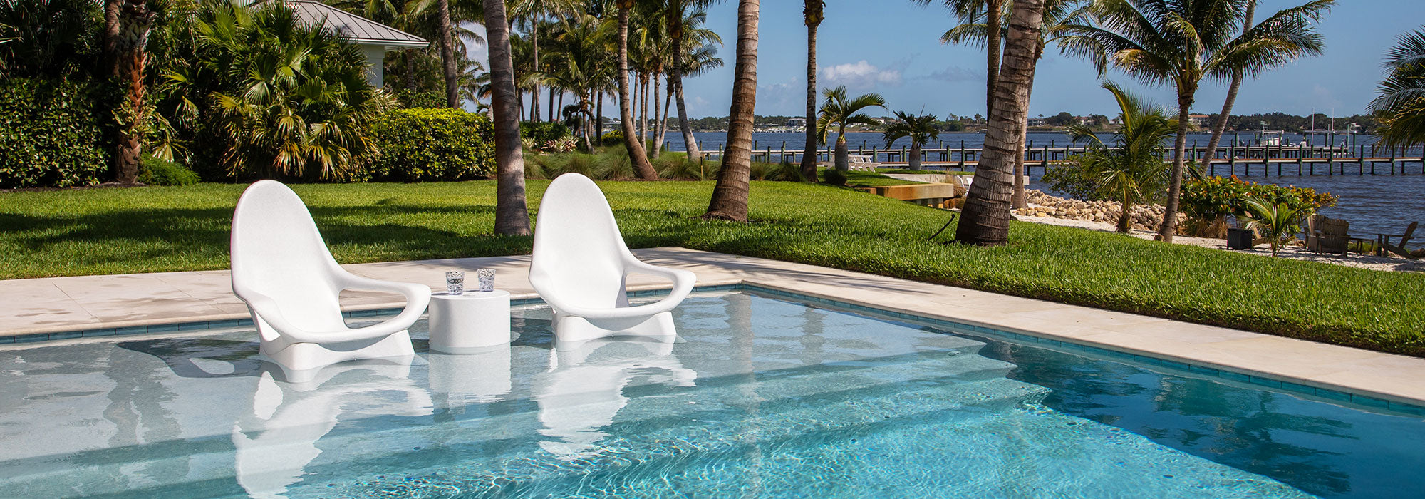 Two Woosah chairs on a pool shelf.